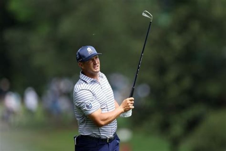 How far does DeChambeau hit an 8 iron?